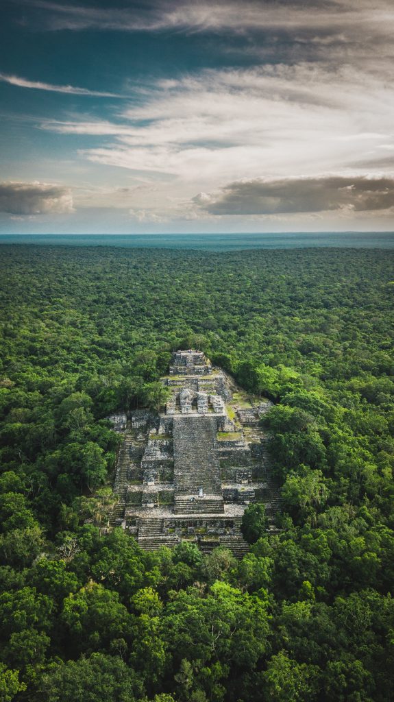 One of the tallest structures at Calakmul rising above the forest. Shutterstock.