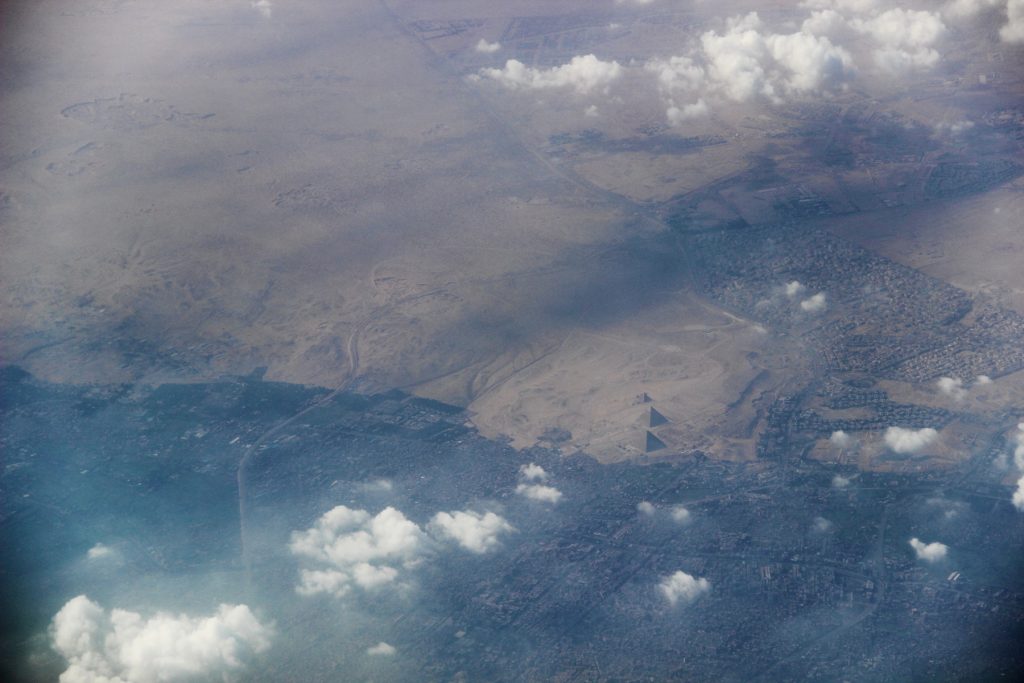 The Giza plateau, its pyramids, the Sphinx and the outskirts of Cairo as seen from the air. Shutterstock.